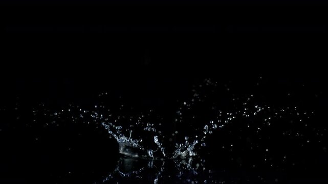 Super Slow Motion Shot of Water Crown Splash Isolated on Black Background at 1000fps.