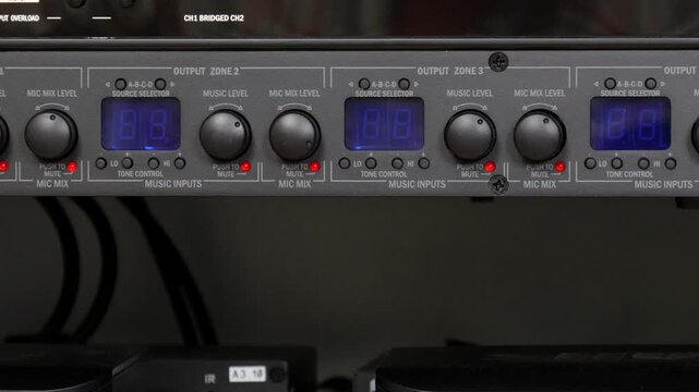 Front control panel of the audio amplifier with level controls and display. 