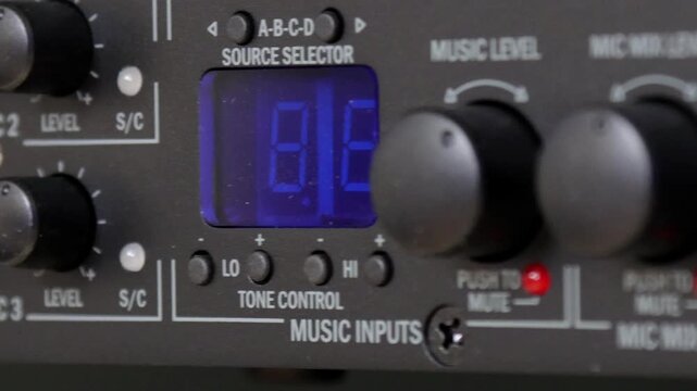 Front control panel of the audio amplifier with level controls and display. 