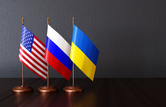 Flags of USA, Russia and Ukraine on the desk
