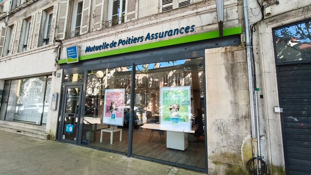 Saintes, France - April 21, 2026: Saintes. Mutuelle de Poitiers Assurances office exterior with large glass windows and promotional posters displayed on the facade