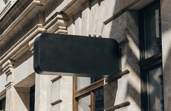 blade sign, blank black rectangular coffee shop sign on facede, for logo mockup