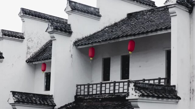 Traditional Chinese White Wall Houses with Red Lanterns in China