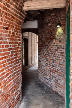 the narrow entrance to coffee yard in york an medieval alley connecting several historic buildings connecting the city streets