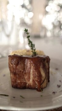Pork Bondiola with Potato Millefeuille in a gala table setting