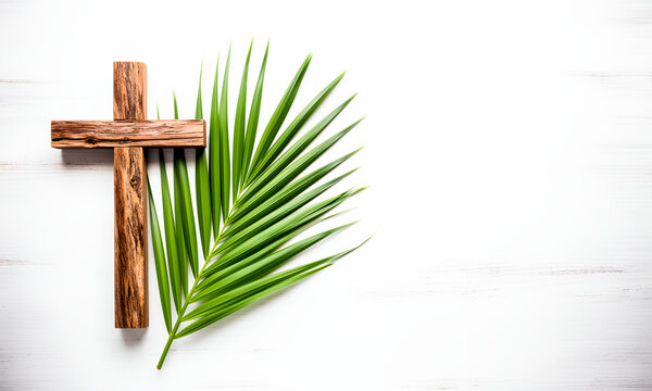 Wooden Christian Cross and Fresh Green Palm Leaf on White Background for Easter Celebration