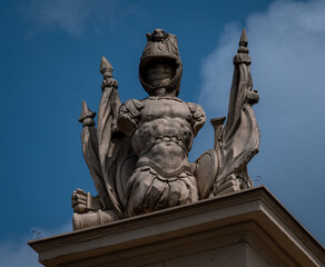 Fototapeta premium Trophy sculpture with helmet and banners on Brandenburger Tor, Potsdam, Germany