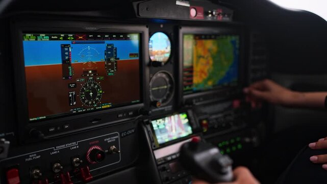 Female pilot navigating modern airplane cockpit