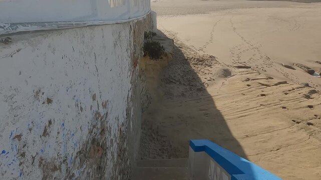 POV Descent Down White Coastal Stairs Revealing Golden Sand Beach, Praia das Ma&ccedil;&atilde;s, Portugal