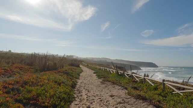 POV Hike Along Wooden Fence on Sandy Coastal Trail Through Atlantic Scrubland, Sintra, Portugal