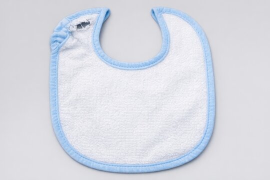 A simple white bib with a blue trim, perfect for everyday use or as part of a costume