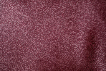 Fototapeta premium Textured burgundy leather material surface