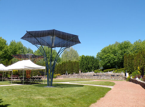 Summer landscape with trees and tent in the park