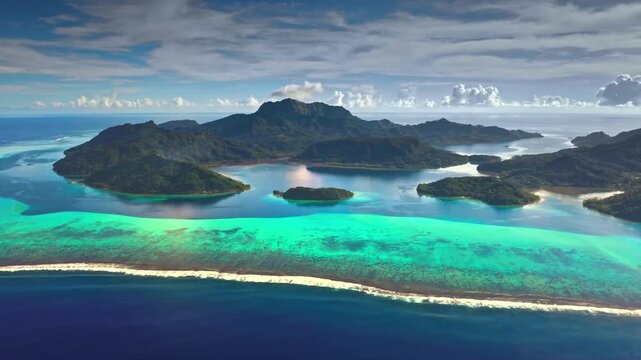 Aerial view of tropical volcanic island with turquoise coral reef lagoon