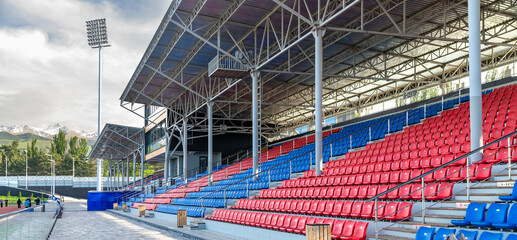 High Altitude Stadium With Empty Grandstand And Mountain Landscape Background © kosoff