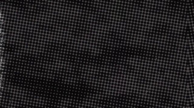Abstract dark black and white halftone dot pattern background texture.