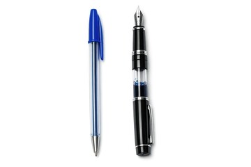 Fototapeta premium Two pens, one with a nib and the other with a ballpoint tip, sit on a surface