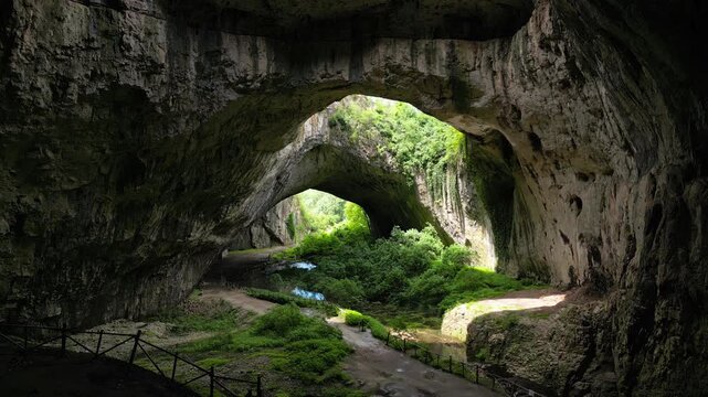 Upward Drone Flight Revealing Skylights Inside Devetashka Cave