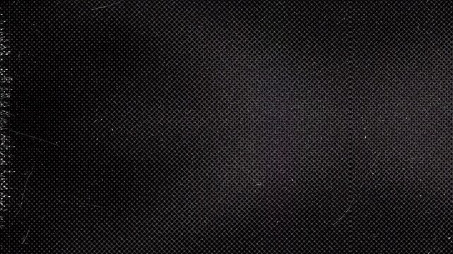 Dark black abstract carbon fiber texture background with subtle geometric pattern.