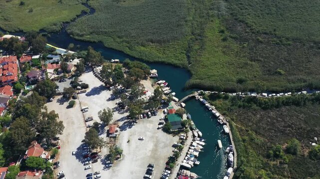 Aerial view of tourist boats navigating the crystal clear waters of Azmak River in Akyaka resort town