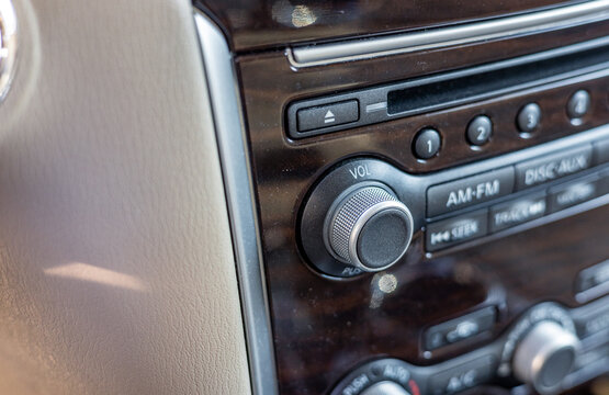 Hand on volume control of car audio, vehicle concept