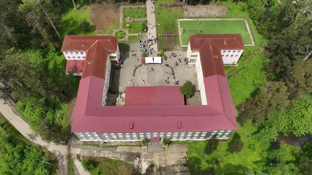 Chakvi, Georgia &mdash; May 22 2026: Aerial drone view of Public School N1 building complex surrounded by lush green trees and coastal landscape in Adjara region.