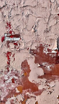 peeling paint texture background in beige, red and white with copy space