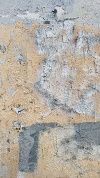peeling paint texture background in beige, grey and white with copy space