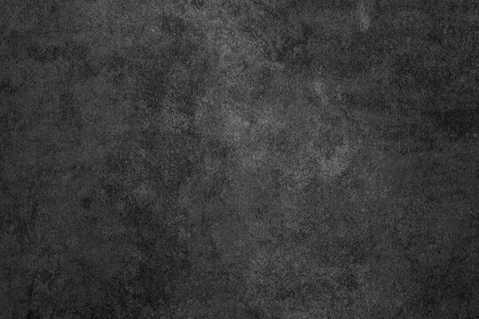 Dark gray textured surface with subtle variations