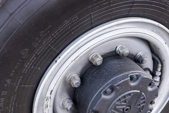 Military equipment and army equipment.. Focus on battlehardened wheel craftsmanship. Indepth view of rugged military wheel components. Close inspection of durable battleworn vehicle wheels