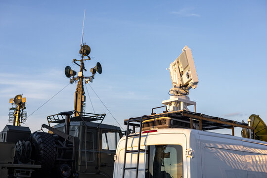 Military equipment and army equipment.. Communication and radar equipment active during twilight times nightly. Deployment of communication devices and radar systems during evening twilight