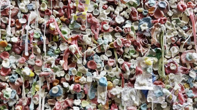 Tight macro of bubblegum lumps and drips on Seattle Post Alley Gum