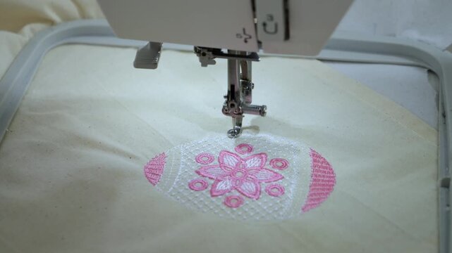 Machine embroidery of an egg with colored threads. Happy Easter, festivals. 4k video close-up