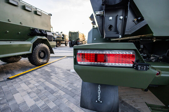 Military equipment and army equipment.. Closeup of vehicle lighting showcasing textures and reflective surfaces. High detail view of military vehicle tail light highlighting reflections