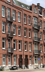 Fototapeta premium Admiraal De Ruijterweg Street View with Residential Building Facades with Balconies in Amsterdam, Netherlands