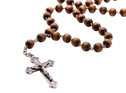Isolated rosary made of natural wooden beads and a detailed silver crucifix for prayer