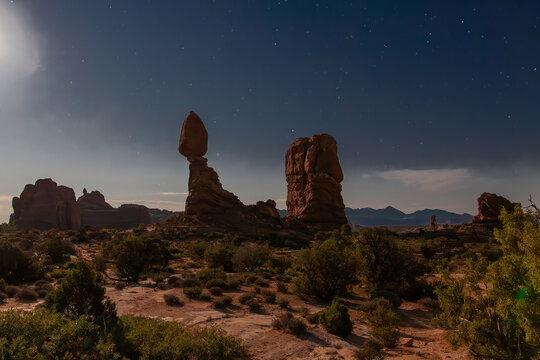 Moonlit Balanced Rock formation at night at Arches National Park, Utah