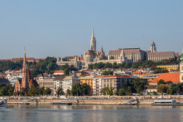 Obraz premium View from the Danube River in Budapest. Fisherman's Bastion, Protestant Church and other old historical buildings