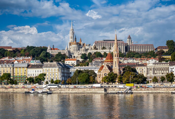 Fototapeta premium View from the Danube River in Budapest. Fisherman's Bastion, Protestant Church and other old historical buildings