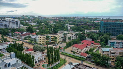 Obraz premium Aerial drone view of Masaki showcasing coastal landscapes, modern development, and urban waterfront living.
