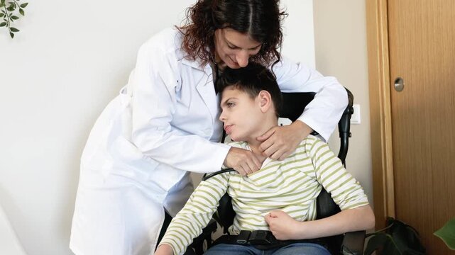 Female doctor auscultating a disabled child in a wheelchair