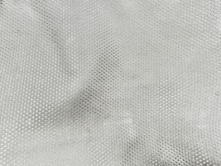 silver gray micro mesh fabric texture creates dynamic metallic waves for modern activewear design backdrops © Arthur