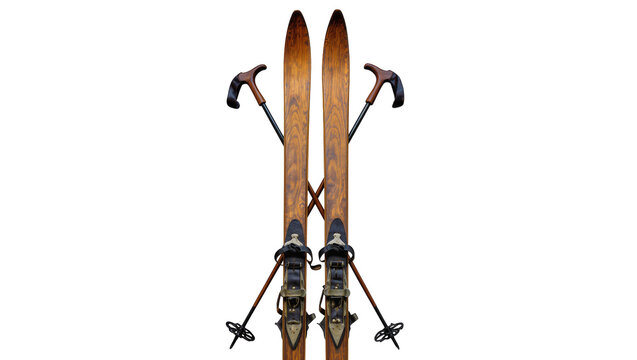 Isolated pair of antique wooden skis with old ski poles, vintage winter sports equipment.