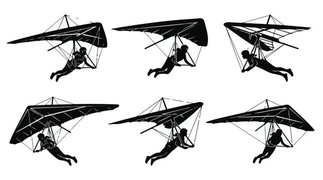 Silhouettes of hang gliders in various flight positions
