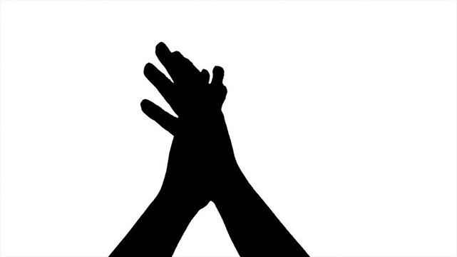 Silhouette of Hand rising up show gesturing two clapping hand on green screen background