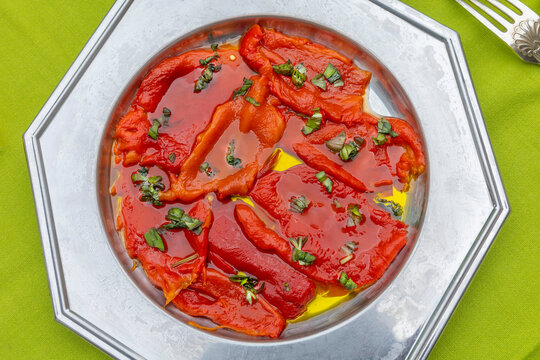 Fresh Red Peppers Arranged on a Silver Plate