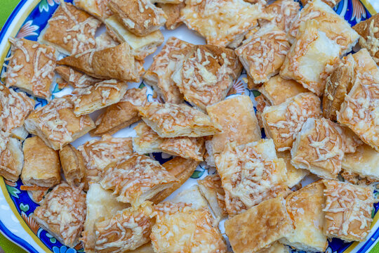 Crunchy Cheese Snacks on a Blue Plate at a Party