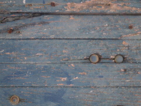 old rusty bolt, wood texture 