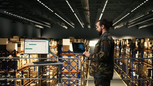 Armed forces staff leveraging artificial intelligence and cloud computing, warehouse logistics management, Black soldier reviewing AI software interface with neural networks for secure defense.
