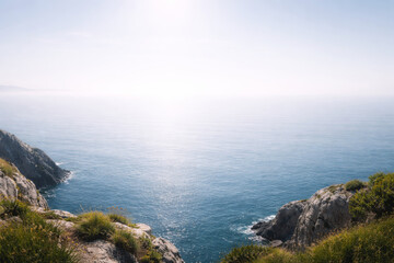 Fototapeta premium Serene coastal view overlooking calm ocean waters and rocky cliffs